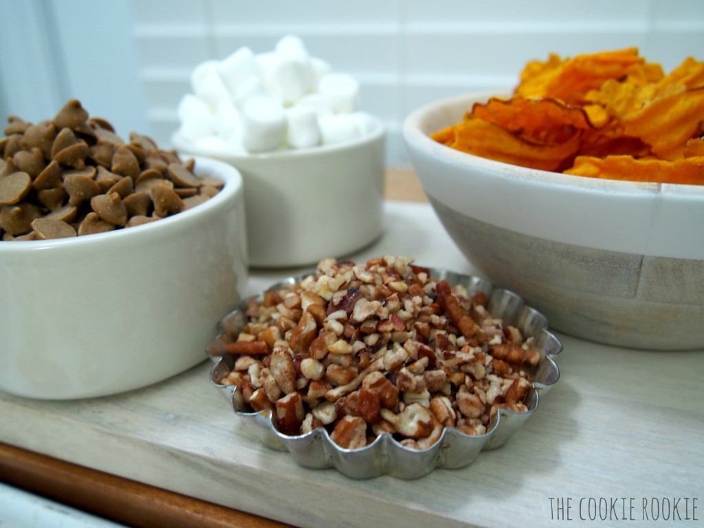 sweet potato chips dipped in cinnamon white chocolate and topped with marshmallows and pecans! my favorite side dish in snack form! loaded sweet potato chips!