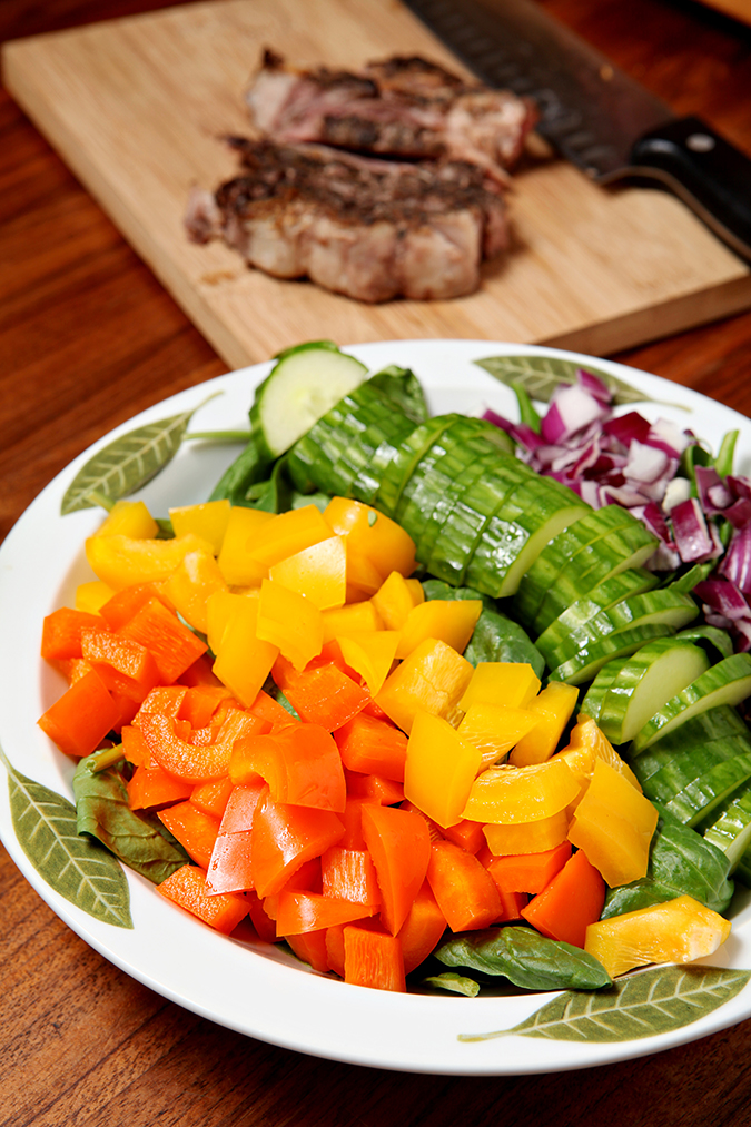 Steak and Sweet Pepper Salad | Summertime salads are delicious, especially when they call for all kinds of fresh vegetables. This salad calls for fresh spinach, sweet peppers, cucumber, red onion and steak, then is topped with a simple mustard vinaigrette! What's not to love?